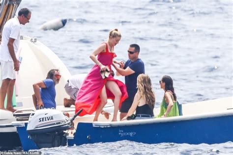 Amber Heard dons a tiny red bikini on a yacht in the Amalfi Coast